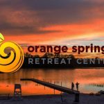 Orange Spring retreat center logo over waterfront sunset