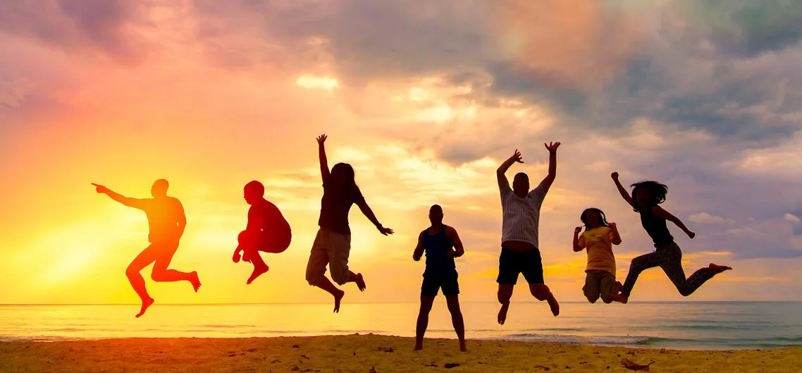 people jumping with joy on the beach at nature retreat in Florida