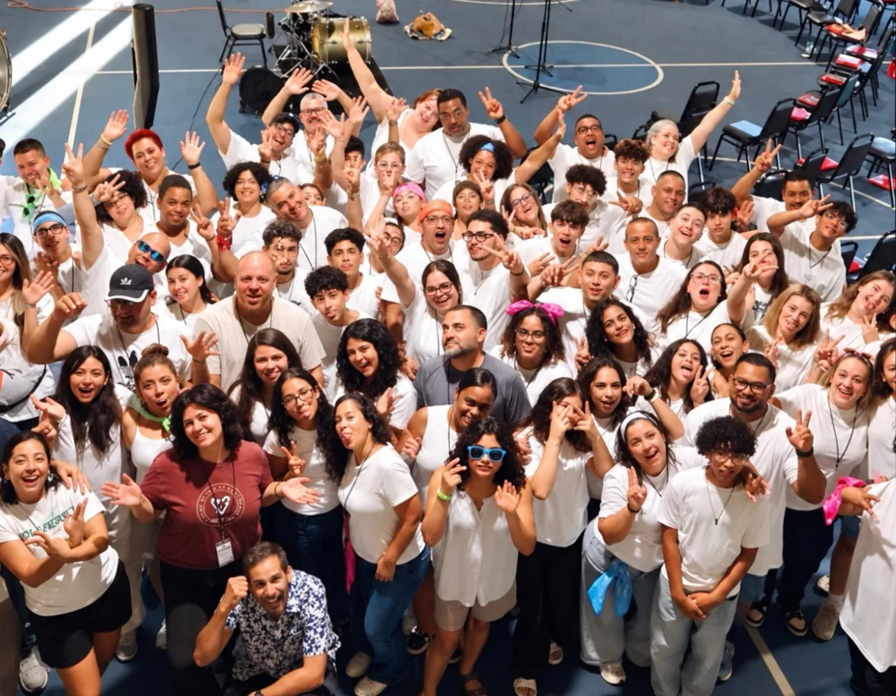 A group of campers and staff posing together